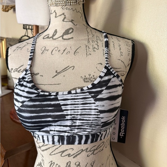 Reebok Women's Strappy Printed Light Support Sports Bra - Core 10
Collection - Picture 6 of 7